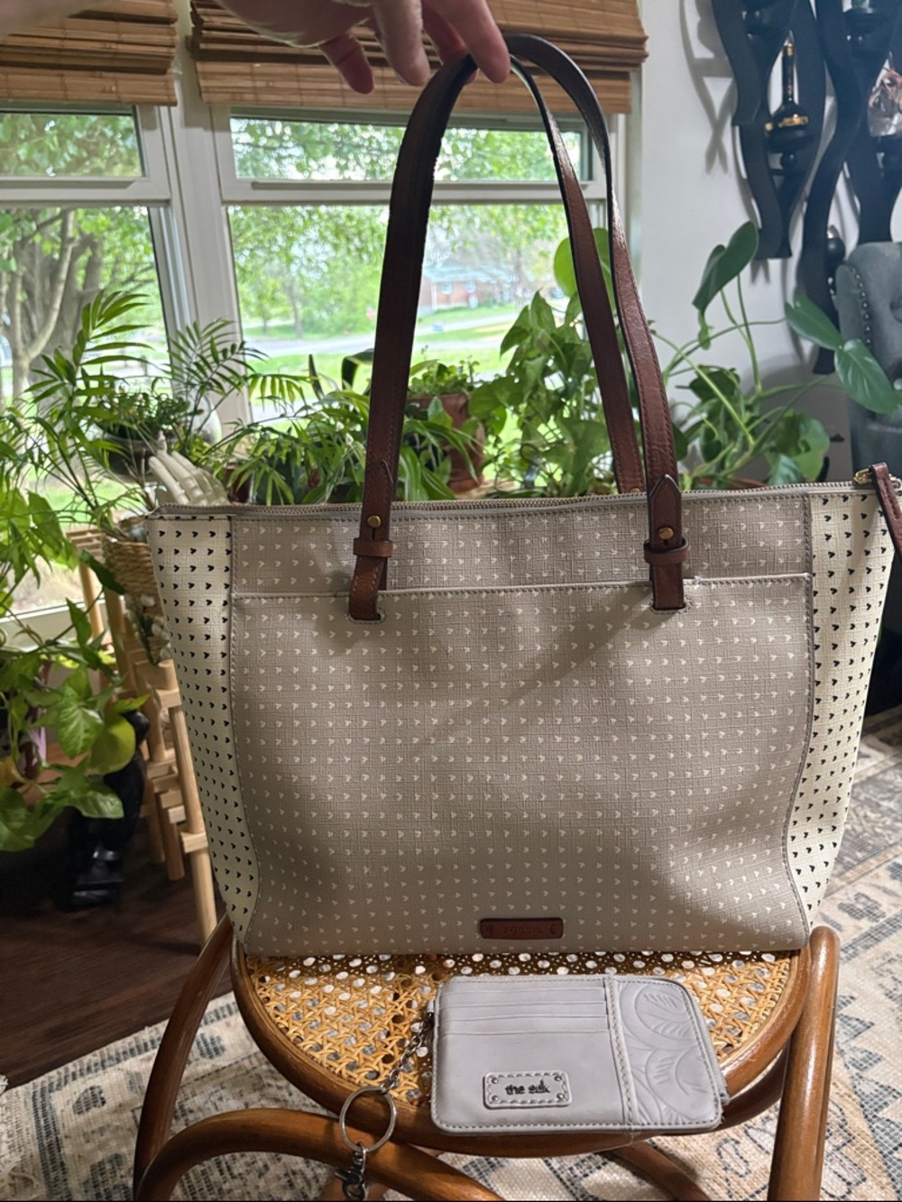 Fossil coated canvas and leather zip top tote bag.